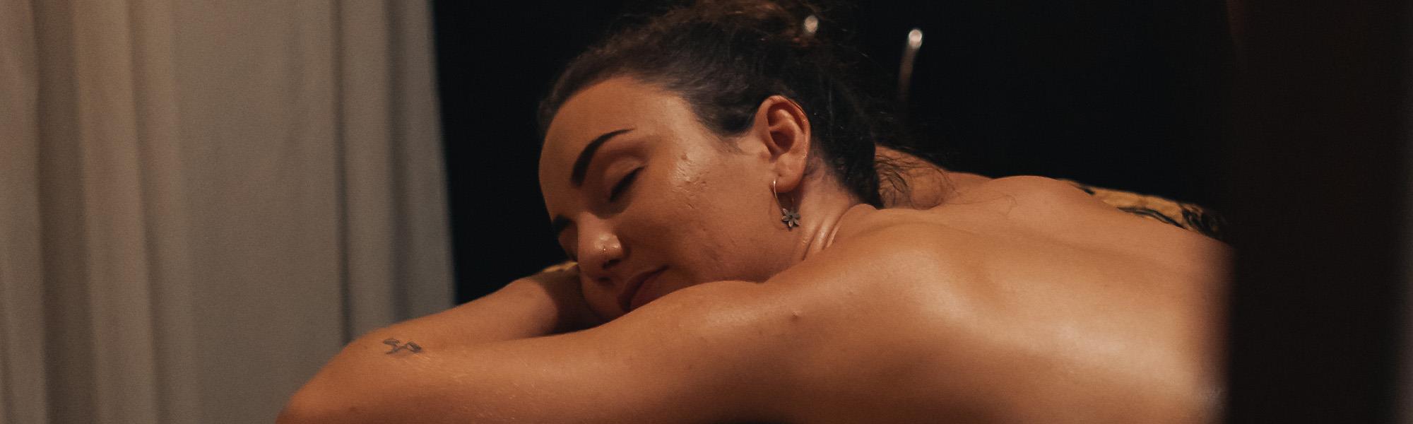woman receiving massage from masseuse 
