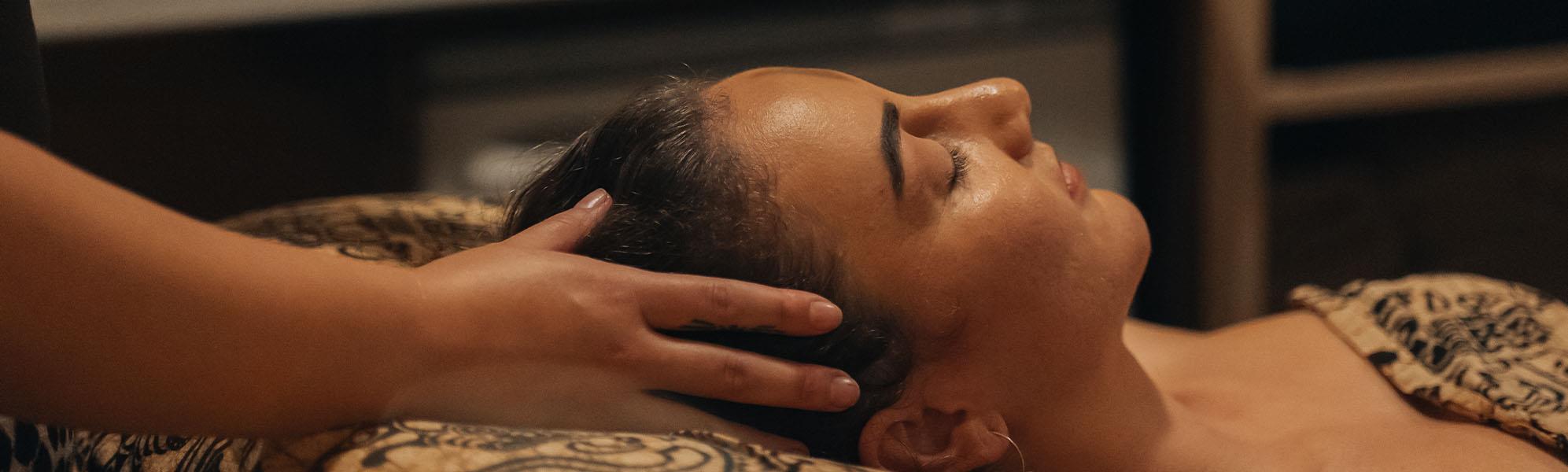 facial treatment being performed on woman
