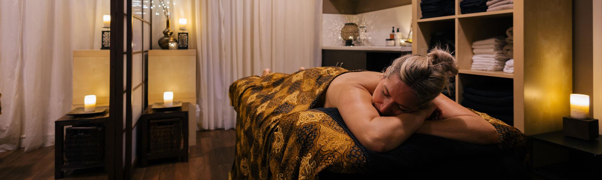 Customer receiving body massage treatment
