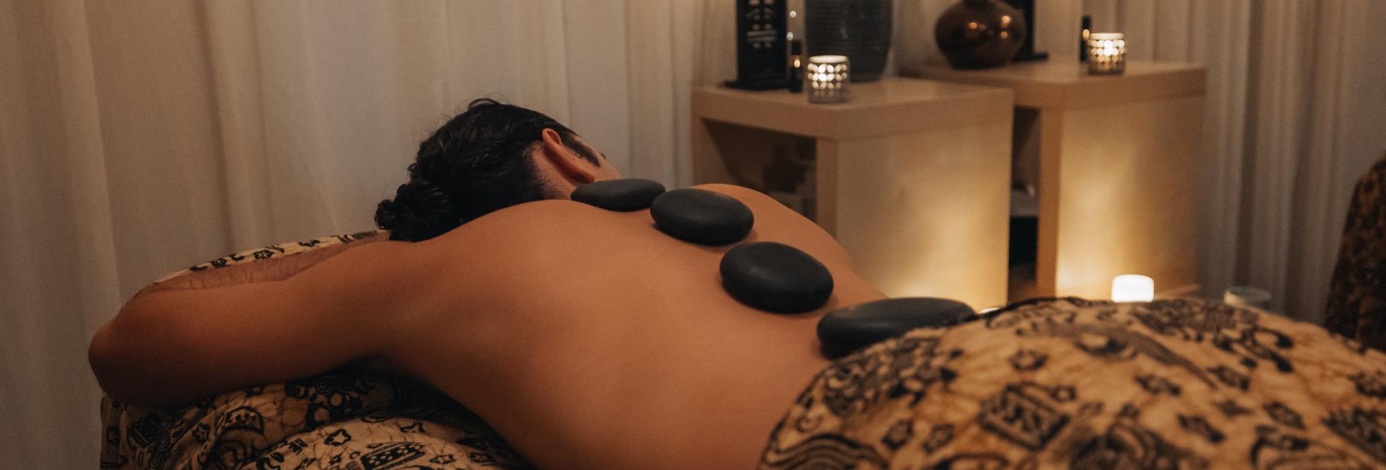 Customer receiving body massage treatment